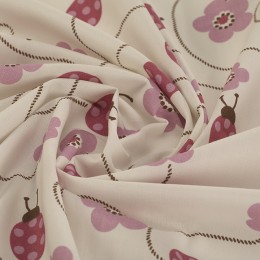 Popeline de coton bio blanche imprimée coccinelles